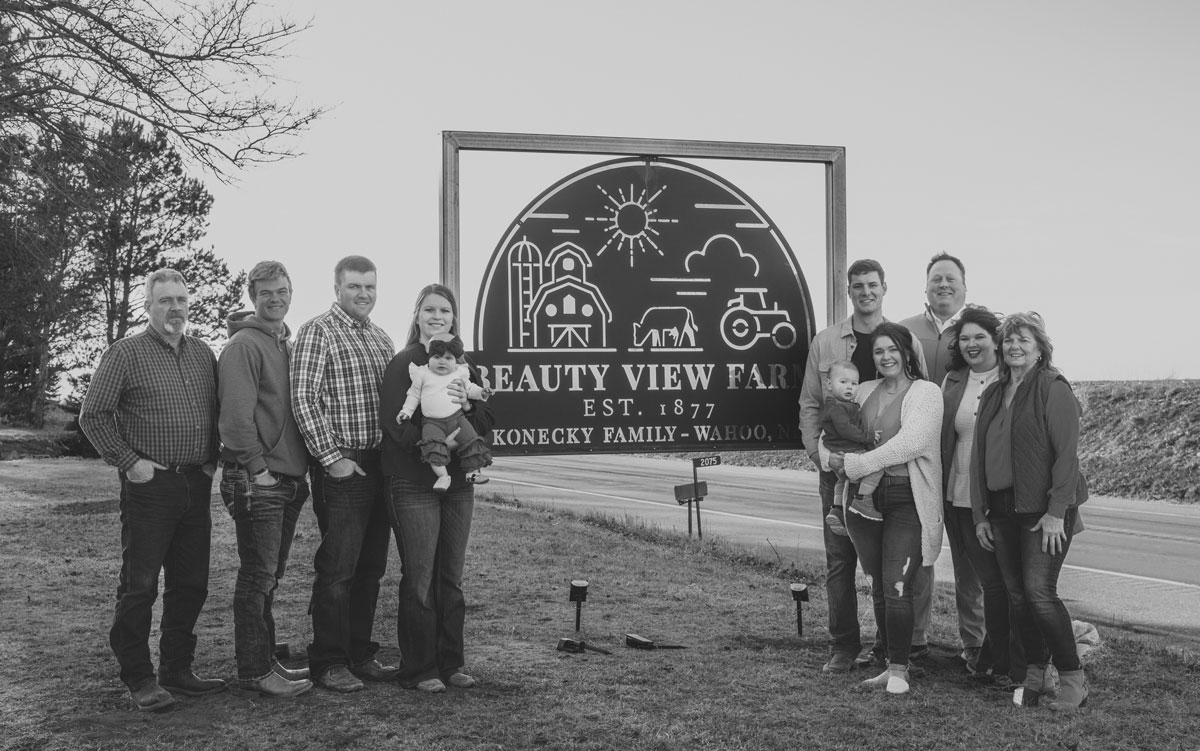 Beauty View Farm family photo by farm sign