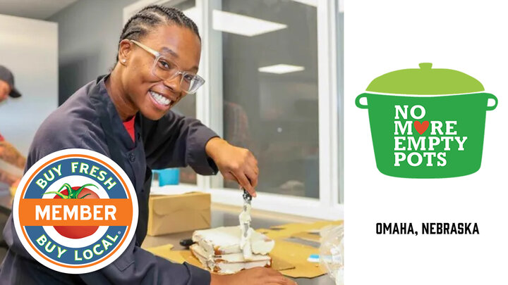 No More Empty Pots spotlight image showing a young woman icing a cake in their commercial kitchen